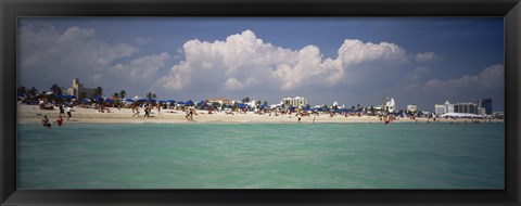 Framed Tourists on the beach, Miami, Florida, USA Print