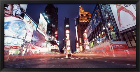Framed Low angle view of sign boards lit up at night, Times Square, New York City, New York, USA Print