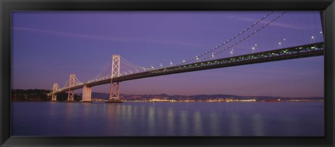 Framed Low angle view of a bridge at dusk, Oakland Bay Bridge, San Francisco, California, USA Print