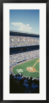 Framed High angle view of spectators watching a baseball match in a stadium, Yankee Stadium, New York City, New York State, USA Print