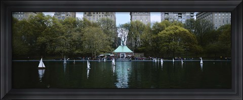 Framed Toy boats floating on water, Central Park, Manhattan Print