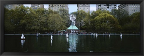 Framed Toy boats floating on water, Central Park, Manhattan Print