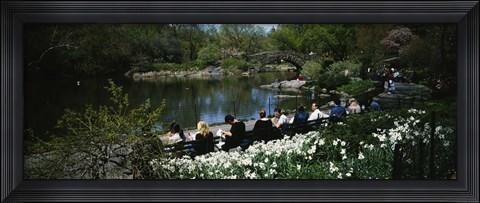 Framed Group of people sitting on benches near a pond, Central Park, Manhattan, New York City, New York State, USA Print
