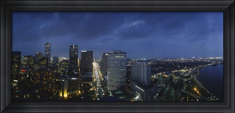 Framed High angle view of buildings in a city lit up at night, New Orleans, Louisiana, USA Print