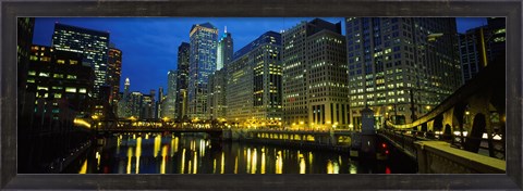 Framed Low angle view of buildings lit up at night, Chicago River, Chicago, Illinois, USA Print