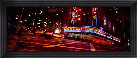 Framed Low angle view of buildings at night, Radio City Music Hall, Rockefeller Center, Manhattan, New York City, New York State, USA Print