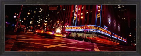Framed Low angle view of buildings at night, Radio City Music Hall, Rockefeller Center, Manhattan, New York City, New York State, USA Print
