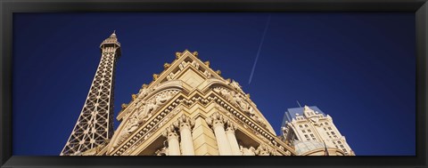 Framed Low angle view of a building in front of a replica of the Eiffel Tower, Paris Hotel, Las Vegas, Nevada, USA Print