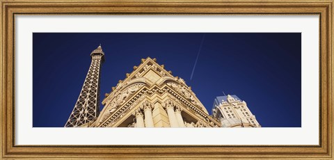 Framed Low angle view of a building in front of a replica of the Eiffel Tower, Paris Hotel, Las Vegas, Nevada, USA Print