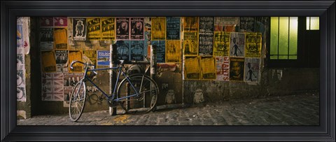 Framed Bicycle leaning against a wall with posters in an alley, Post Alley, Seattle, Washington State, USA Print