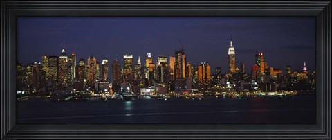 Framed Skyscrapers lit up at night in a city, Manhattan, New York City, New York State, USA Print