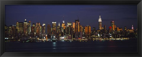 Framed Skyscrapers lit up at night in a city, Manhattan, New York City, New York State, USA Print