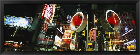 Framed Low angle view of buildings lit up at night, Times Square, Manhattan, New York City, New York State, USA Print