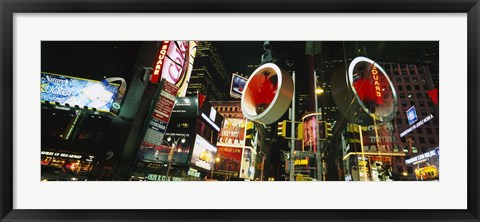 Framed Low angle view of buildings lit up at night, Times Square, Manhattan, New York City, New York State, USA Print