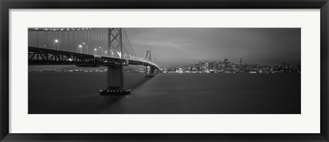 Framed Low angle view of a suspension bridge lit up at night, Bay Bridge, San Francisco, California, USA Print