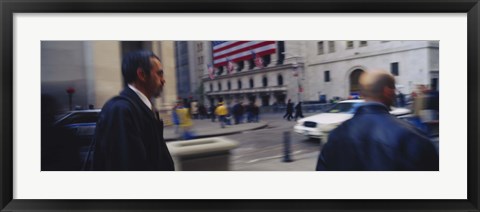 Framed Two people walking, New York Stock Exchange, Wall Street, Times Square, Manhattan, New York City, New York State, USA Print