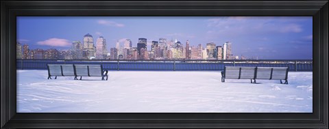 Framed Park benches in snow with a city in the background, Lower Manhattan, Manhattan, New York City, New York State, USA Print