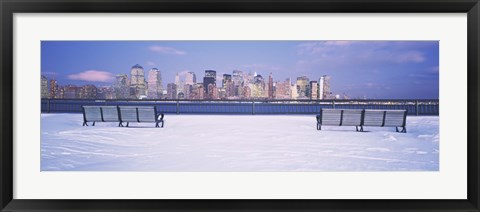 Framed Park benches in snow with a city in the background, Lower Manhattan, Manhattan, New York City, New York State, USA Print