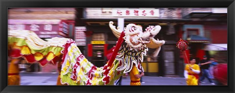 Framed Group of people performing dragon dancing on a road, Chinatown, San Francisco, California, USA Print