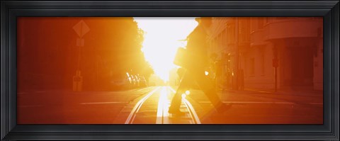 Framed Side profile of a person crossing the cable car tracks at sunset, San Francisco, California, USA Print