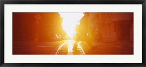 Framed Side profile of a person crossing the cable car tracks at sunset, San Francisco, California, USA Print