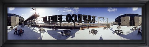 Framed Tourist sitting on a roof outside a baseball stadium, Seattle, King County, Washington State, USA Print