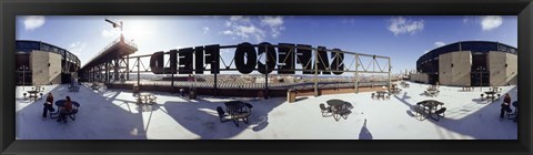 Framed Tourist sitting on a roof outside a baseball stadium, Seattle, King County, Washington State, USA Print