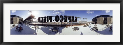 Framed Tourist sitting on a roof outside a baseball stadium, Seattle, King County, Washington State, USA Print