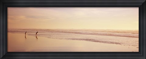 Framed Two children playing on the beach, San Francisco, California, USA Print