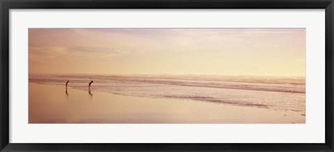 Framed Two children playing on the beach, San Francisco, California, USA Print