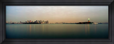 Framed River with the city skyline and Statue of Liberty in the background, New York Harbor, New York City, New York State, USA Print