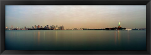 Framed River with the city skyline and Statue of Liberty in the background, New York Harbor, New York City, New York State, USA Print