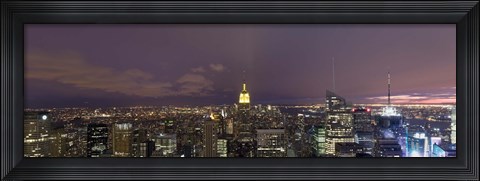 Framed Buildings in a city lit up at dusk, Midtown Manhattan, Manhattan, New York City, New York State, USA Print