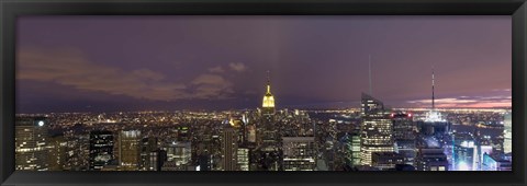 Framed Buildings in a city lit up at dusk, Midtown Manhattan, Manhattan, New York City, New York State, USA Print