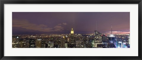 Framed Buildings in a city lit up at dusk, Midtown Manhattan, Manhattan, New York City, New York State, USA Print