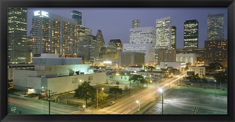 Framed Skyscrapers lit up at night, Houston, Texas Print