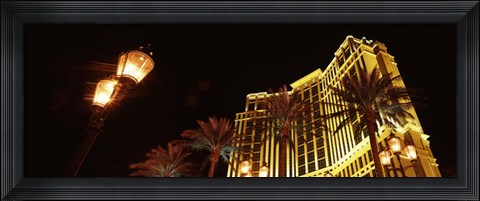 Framed Low angle view of a hotel lit up at night, The Strip, Las Vegas, Nevada, USA Print