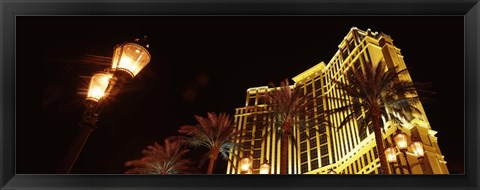 Framed Low angle view of a hotel lit up at night, The Strip, Las Vegas, Nevada, USA Print