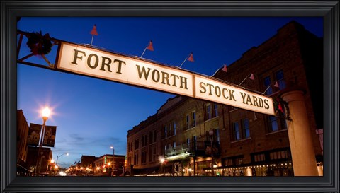Framed Signboard over a road at dusk, Fort Worth Stockyards, Fort Worth, Texas, USA Print