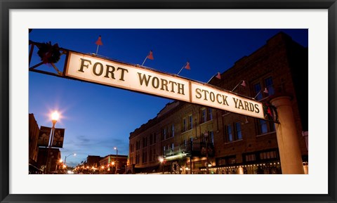 Framed Signboard over a road at dusk, Fort Worth Stockyards, Fort Worth, Texas, USA Print