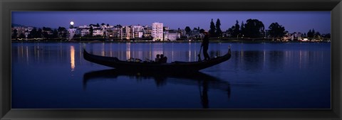Framed Boat in a lake with city in the background, Lake Merritt, Oakland, Alameda County, California, USA Print