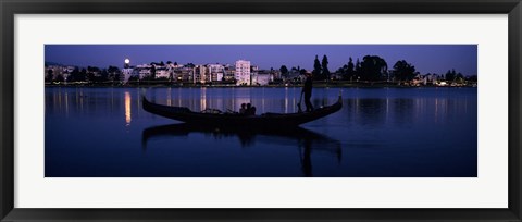 Framed Boat in a lake with city in the background, Lake Merritt, Oakland, Alameda County, California, USA Print