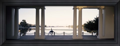 Framed Person stretching near colonnade, Lake Merritt, Oakland, Alameda County, California, USA Print