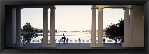 Framed Person stretching near colonnade, Lake Merritt, Oakland, Alameda County, California, USA Print