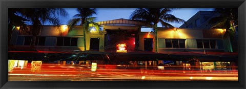 Framed Traffic in front of a building at dusk, Art Deco District, South Beach, Miami Beach, Miami-Dade County, Florida, USA Print