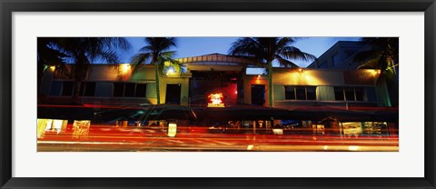 Framed Traffic in front of a building at dusk, Art Deco District, South Beach, Miami Beach, Miami-Dade County, Florida, USA Print