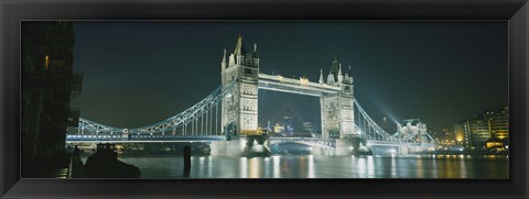 Framed Low angle view of a bridge lit up at night, Tower Bridge, London, England Print