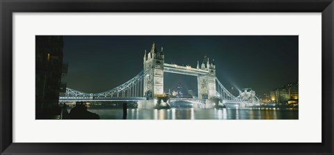 Framed Low angle view of a bridge lit up at night, Tower Bridge, London, England Print