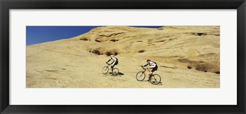 Framed Side profile of two men mountain bilking on rocks, Slickrock Trail, Moab, Utah, USA Print