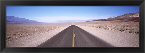 Framed USA, California, Death Valley, Empty highway in the valley Print